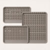 Custom silicone cat litter mats shown in different size options with a consistent surface pattern