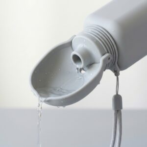 Close-up of the open drinking bowl and bottle connection on a silicone pet travel water bottle