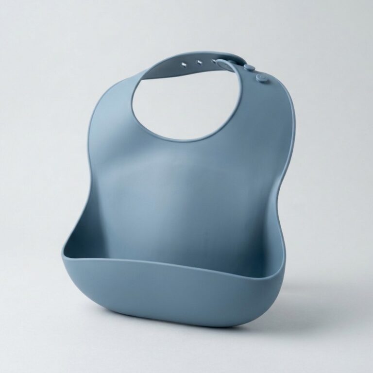 Front view of a one-piece silicone baby bib with an integrated food-catching pocket