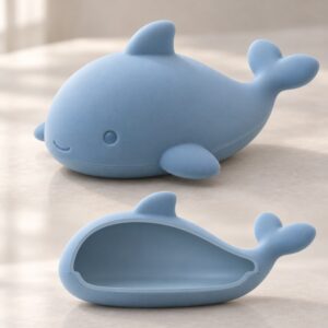 Engineering cross-section of hollow silicone whale bath toy showing sealed air chamber and shell structure