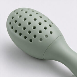 Close-up of silicone fruit feeder openings and the transition between the feeding head and handle