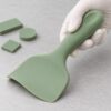 Thickened ergonomic handle and flexible head of a silicone pet food spatula