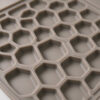 Close-up of shallow rounded collection cells on a custom silicone cat litter mat
