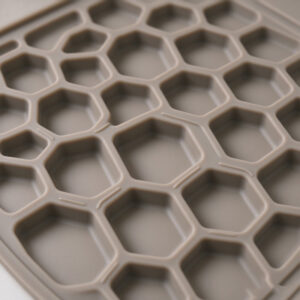 Close-up of shallow rounded collection cells on a custom silicone cat litter mat