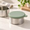 Silicone pet food can lid fitted onto an opened metal pet food can