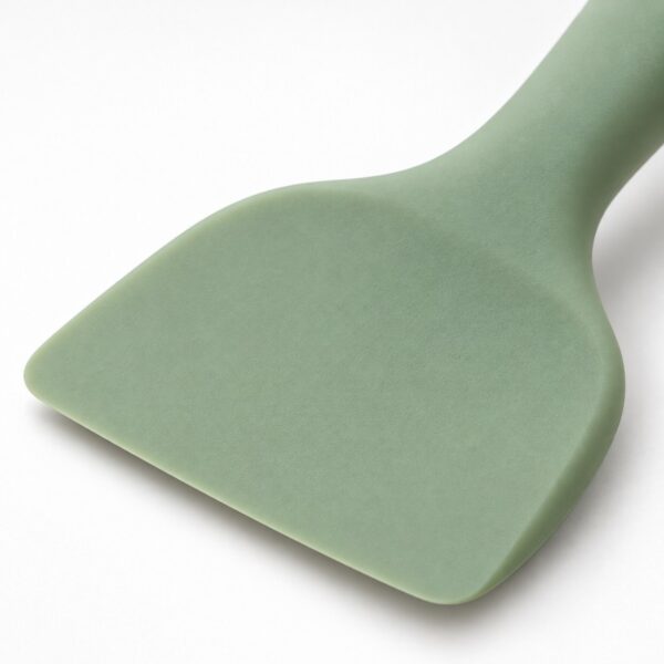 Rounded flexible scraper head of a one-piece silicone pet food spatula