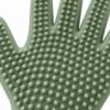Rounded flexible silicone grooming nubs on the palm of a pet grooming glove