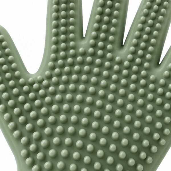 Rounded flexible silicone grooming nubs on the palm of a pet grooming glove